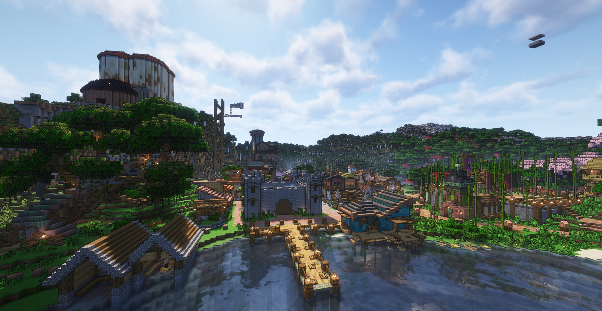 An overview of Port Crimson, taken about a year after we started. Featuring most of the village, from the silos on the hill to the nether gallows.